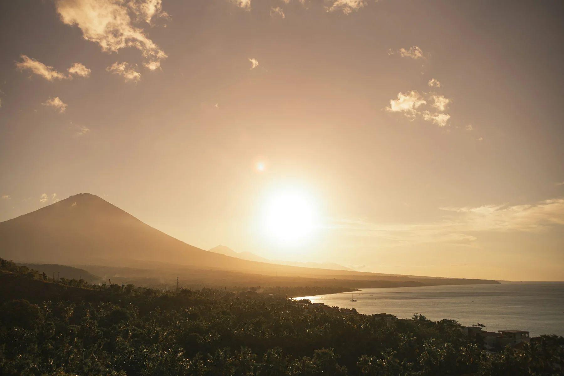 Sunset over Mount Agung and the Amed coastline.